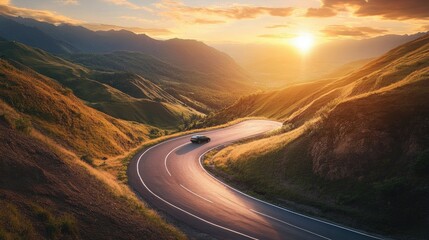 Poster - A small car cruises along a winding mountain road, with the surrounding landscape bathed in the warm glow of the setting sun, offering a breathtaking panoramic view.