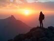 © Michael - Hiker standing on top of a mountain at sunrise enjoying the breathtaking view
