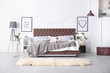 © New Africa - Cozy bedroom interior with mocha mousse shade. Trendy color of 2025 year