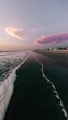 © BOJOShop - Serene Sunrise Beachscape  Ocean Waves  Coastal Homes  Pink Sky