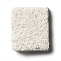 Poster - Textured white block with porous surface casting a soft shadow on a clean white background