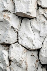 Poster - White rock surface with deep cracks and rough texture creating a natural abstract pattern