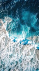 Poster - Aerial view of ocean waves crashing on shore with turquoise water and white sea foam