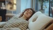 © Ahmed - Woman lying on bed with orthopedic pillow in furniture store