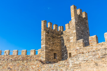 Wall Mural - Towers and walls of an ancient stone Genoese fortress in Sudak on the Black Sea coast in Crimea, Russia. Here is the museum-reserve 