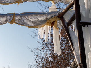Poster - A metal pole with ice on it