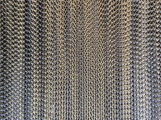 Poster - A detailed close-up shot of a unique textured fabric. The pattern is intricately woven, creating a visually interesting surface. Textured Fabric: Close-up of a uniquely patterned woven material