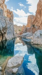 Wall Mural - Serene coastal waters reflect sky and surrounding rocky landscape in a tranquil location