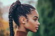 © Salander Studio - side profile of a woman with a braided pony tail