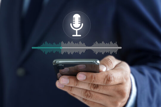 Businessman voice recording the conversation via smartphone with customers, telemarketing, consulting, voice assistance access to information and applications, write a message and send a message.