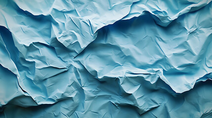 Fototapete - A wrinkled blue paper texture showcasing various shades and folds, creating an abstract and artistic visual effect