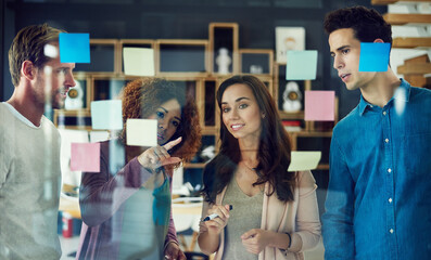 Fototapete - Brainstorming, question and group in office, ideas and teamwork for project, creative and public relations. Discussion, people and employees with sticky notes in meeting, editor or plan for campaign