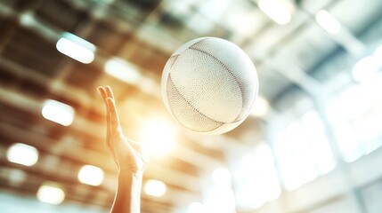 Wall Mural - volleyball served mid-air with hand just pulling away in bright gym setting