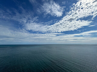 Wall Mural - sea blue shining waters and beautiful sky clouds horizon.