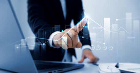 Leinwandbilder - Businessman draw finance growth and graph chart diagram and analysing sale data.Analysis finance grow graph and market investment. Business strategy and data on economic growth graph chart.