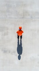 Poster - Aerial View of First Responder in Vibrant Gear on Minimalist Concrete - Modern Crisis Management Training and Urban Safety Solutions for Emergency Preparedness