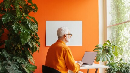 Poster - Biophilic Co-Living Workspace Elderly Man in Bright Orange Modern Area with Lush Greenery and Natural Light - Enhanced Productivity and Social Inclusivity for Urban Development