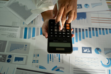 man hand using calculator finance budgeting and tax financial cost calculation statistical data anal