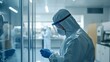 © Ytnart - A researcher in full protective gear works within a laboratory, showcasing the importance of safety in scientific research