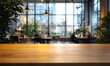 © minahus - Wooden Table in a Blurred Modern Cafe Setting