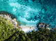 © AmazingAerialAgency - Aerial view of beautiful tropical beach with turquoise water and sandy shore surrounded by lush forest, Mueang Satun, Thailand.
