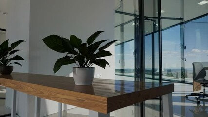 Poster - Explore the essence of visionary leadership in a minimalist setting defined by glass walls, simple furniture, and abundant natural lighting that reflects clarity and openness.