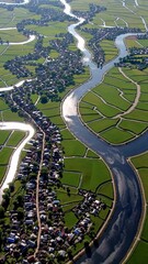 Poster - An aerial view of a fertile delta region showing braided channels and lush farmland, dotted with small settlements.