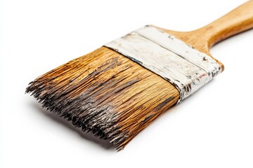 Poster - Paintbrush with worn bristles resting on a white surface after a creative home improvement project