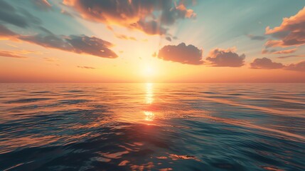 Wall Mural - A breathtaking sunset over a calm ocean, with the sun's golden rays reflecting on the water's surface.