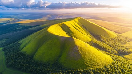 Wall Mural - A magnificent mountain crest under a clear blue sky with scattered clouds