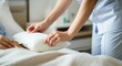 © Anna - Nurse adjusting pillow for patient in hospital bed providing comfort and care