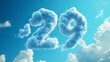 © CybStars - Fluffy cloud numbers '29' against a bright blue sky, ideal for showcasing a countdown or celebration theme, capturing a whimsical atmosphere.