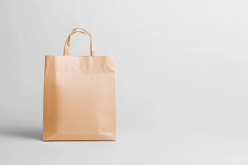 Poster - Photorealistic mockup of a brown paper bag set against a minimalist backdrop for design purposes