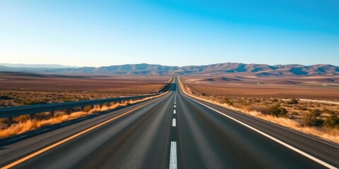 Wall Mural - Straight highway cutting through a scenic landscape under a clear blue sky, countryside, distance