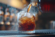 © AgungRikhi - Dark Brown Fizzy Drink Pouring into Ice-Filled Glass at Bar