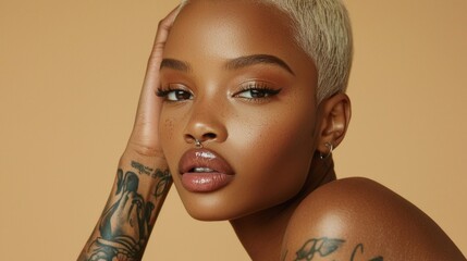 Poster - A model poses gracefully with a subtle smile, showcasing her unique tattoos and flawless skin. The warm background highlights her distinctive features, creating an alluring ambiance