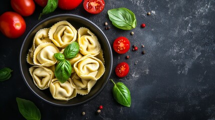 Wall Mural - A vibrant overhead shot of tortellini in a bowl, garnished with fresh basil leaves and cherry tomatoes, emphasizing the colorful presentation and freshness of the dish.