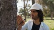 © Polonio Video - Scientist Checks the Bark of a Diseased Tree to Decide on Felling Deforestation