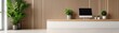 © nuttapong - Modern workspace with plants and wooden decor.