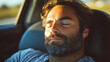 © Infinity Lens - Closeup of a handsome man sleeping in his car while driving. sleepy and tired male person napping while controlling the vehicle on the highway or city street. safety danger,accident risk,drowsy driver