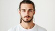 © The 2R Artificiality - male portrait with ponytail and beard looking directly at camera on white background showcasing neutral expression and youthful appearance