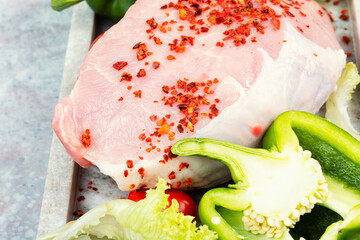 Wall Mural - A photo of raw pork on the table.