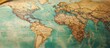© STwul - Vintage world map detail, close-up, textured surface, global travel concept