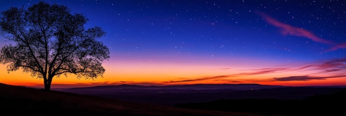 Wall Mural - Stunning Sunset Over the Mountains with a Majestic Tree Silhouette