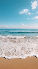 serene beachscape with gentle waves and bright blue sky at tranquil seashore