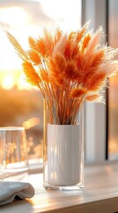 Poster -   A vase brimming with orange blossoms perched atop a table, adjacent to a wine glass