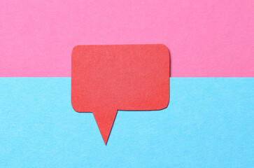 Poster - Red blank cut out paper speech bubble with copy space for text on pink blue background, flat lay top view conceptual backdrop