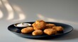 © LoFi J. - Chicken Nuggets with Dipping Sauce on Black Plate