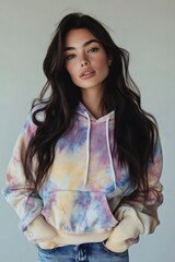 Wall Mural - Brunette model posing in tie dye hoodie and jeans