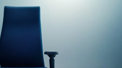 Aufkleber - A modern blue office chair featuring ergonomic design elements stands against a soft gradient gray background, offering ample copy space for branding and presentation
